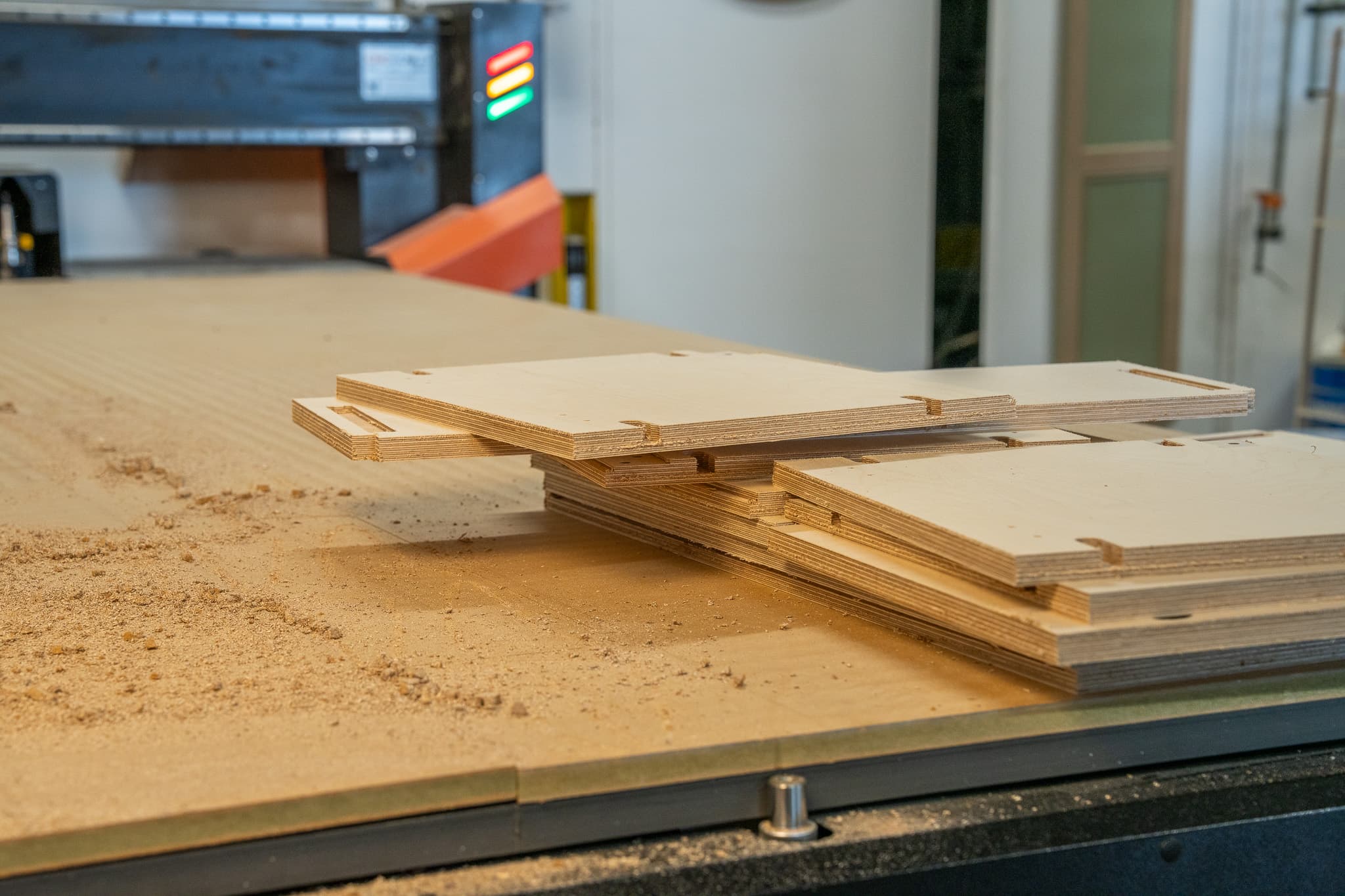 Wooden shelves and parts for modular shelving units on a workshop bench